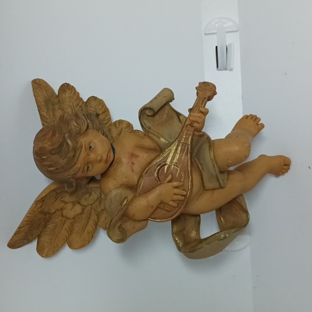 And authentic reproduction of an original Fontanini sculpture hand-painted